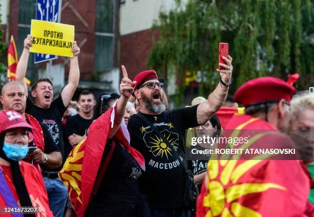 People shout slogans and wave flags during the protest in front of governamet building on under the slogan Ultimatum no thanks in Skopje on July 2,...