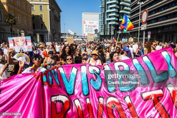 Members of the Lesbian, Gay, Bisexual and Transgender community gather together after taking part in the annual Pride Parade in the streets of Milano...
