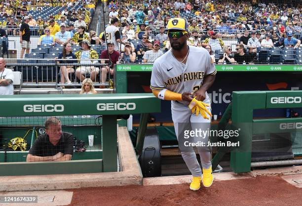 Andrew McCutchen of the Milwaukee Brewers runs onto the field to warm up before the game against the Pittsburgh Pirates at PNC Park on July 2, 2022...