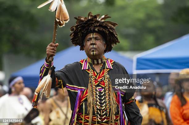 Indigenous peoples from many tribes from across the Americas take part in the Grand Entry during the Mashpee Wampanoag Tribe's 101st annual Powwow in...