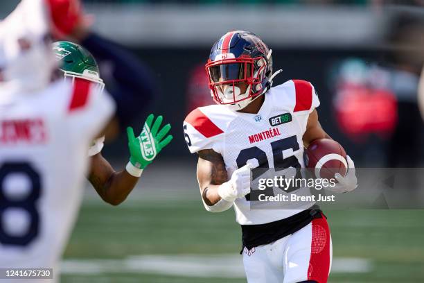 Walter Fletcher of the Montreal Alouettes carries the ball in the first half of the game between the Montreal Alouettes and the Saskatchewan...