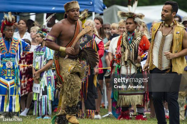 Indigenous peoples from many tribes from across the Americas take part in the Grand Entry during the Mashpee Wampanoag Tribe's 101st annual Powwow in...