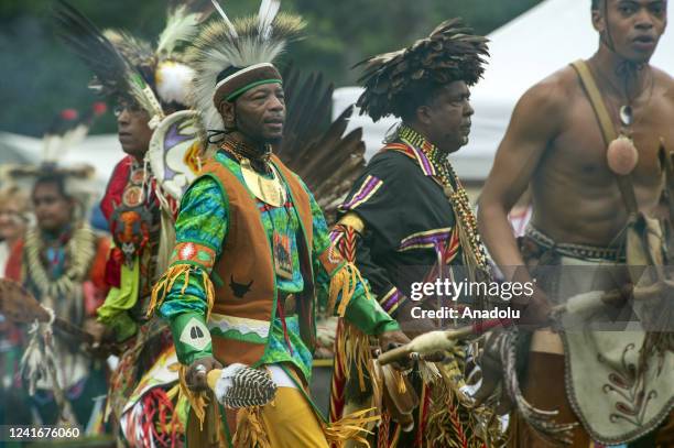 Indigenous peoples from many tribes from across the Americas take part in the Grand Entry during the Mashpee Wampanoag Tribe's 101st annual Powwow in...