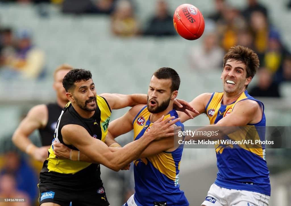 Josh Rotham Marlion Pickett of the Tigers, Josh Rotham of the Eagles and Andrew ...