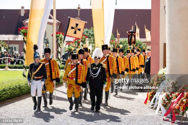 July 2022, Baden-Wuerttemberg, Altshausen: The yellow hussars leave before the start of the funeral service for Carl Duke of Württemberg at the...