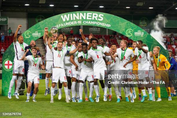 Harvey Vale of England lifts the UEFA European Under-19 Championship Trophy following their sides victory after the UEFA European Under-19...