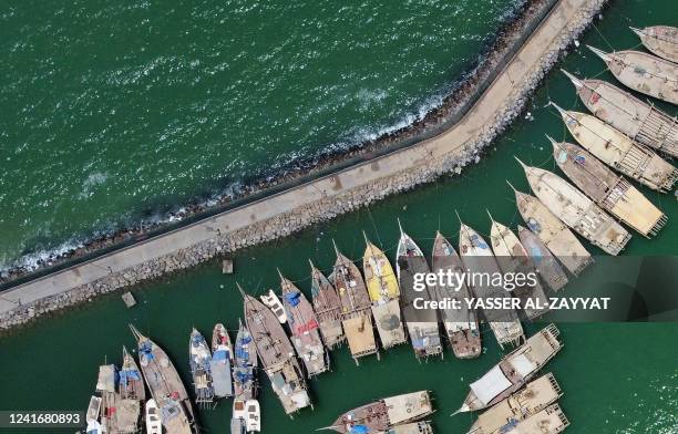 An aerial view shows traditional fishing boats docked at the Souq sharq harbour, in Kuwait City on July 3, 2022.