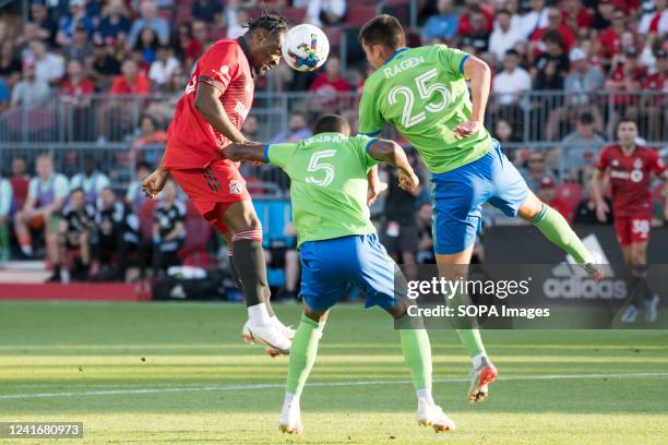Ayo Akinola and Nouhou Tolo in action during the MLS game between Toronto FC and Seattle Sounders FC at BMO field in Toronto. The game ended 2-0 For...