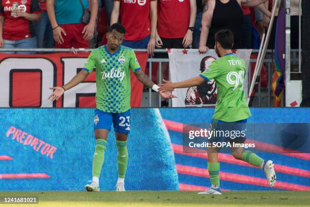 Leo Chu celebrates scoring a goal with team mate Dylan Teves during the MLS game between Toronto FC and Seattle Sounders FC at BMO field in Toronto....