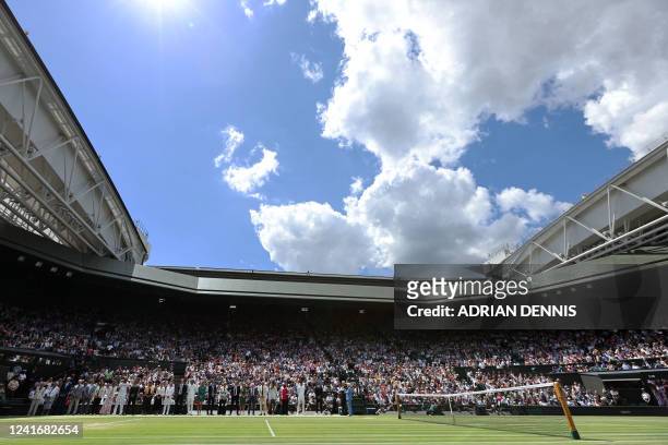Former winners of Wimbledon tournament stand on the court during the Centre Court Centenary Ceremony, on the seventh day of the 2022 Wimbledon...