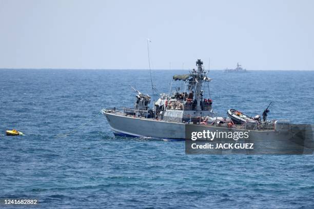 An Israeli navy vessel is pictured off the coast of Rosh Hanikra, an area at the border between Israel and Lebanon , on July 3, 2022. - The Israeli...