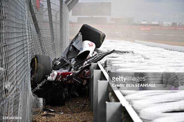 Alfa Romeo Chinese driver Zhou Guanyu is seen in the crash barriers during an incident at the star during the Formula One British Grand Prix at the...