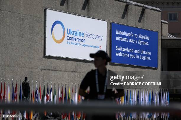 Police officer stands in front of the entrance of the Palazzo dei Congressi on the eve of a two-day International conference on reconstruction of...