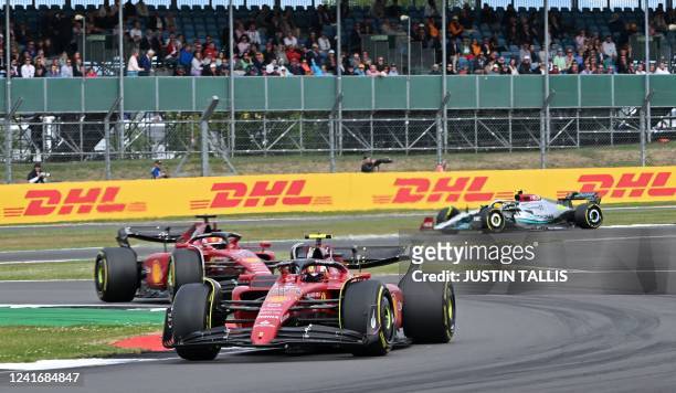 Ferrari's Monegasque driver Charles Leclerc , Ferrari's Spanish driver Carlos Sainz Jr and Mercedes' British driver Lewis Hamilton drive during the...