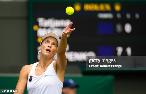 Tatjana Maria of Germany in action against Jelena Ostapenko of Latvia in her fourth round match during Day Seven of The Championships Wimbledon 2022...