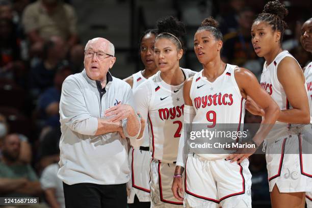 Head Coach Mike Thibault of the Washington Mystics talks to Alysha Clark and Natasha Cloud during the game against the Connecticut Sun on July 3,...