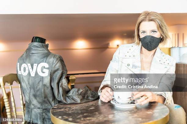 Fashion designer Inés Penelas poses next to a mannequin dressed in a jacket designed exclusively for the music group "La oreja de Van Gogh" in the...