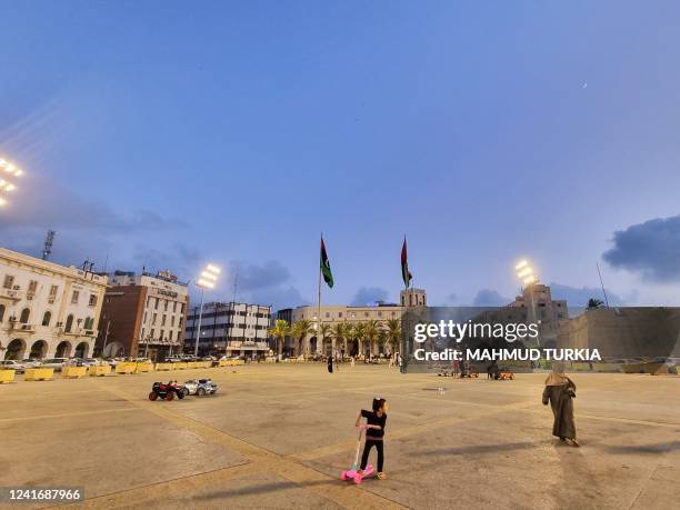 Libyan families gather at the Martyrs' Square of Libya's capital Tripoli on July 3, 2022.