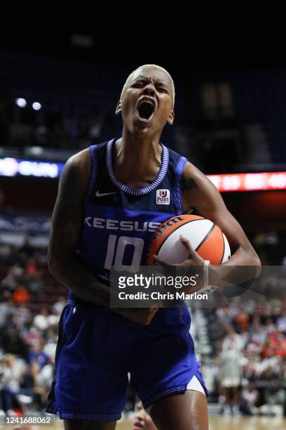 Courtney Williams of the Connecticut Sun celebrates during the game against the Washington Mystics on July 3, 2022 at Mohegan Sun Arena in...