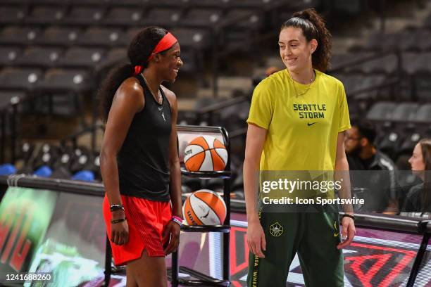 Seattle forward Breanna Stewart talks with Atlanta guard Rhyne Howard prior to the start of the WNBA game between the Seattle Storm and the Atlanta...