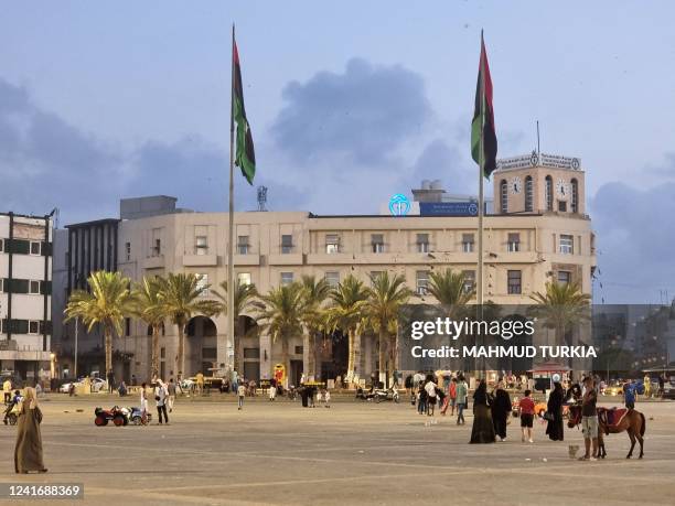Libyan families gather at the Martyrs' Square of Libya's capital Tripoli on July 3, 2022.