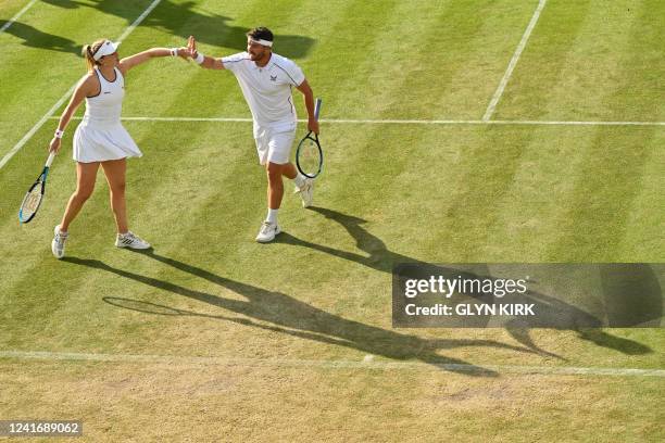 Britain's Jonny O'Mara and Alicia Barnett react as they compete against Britain's Jamie Murray and US player Venus Williams during their mixed...