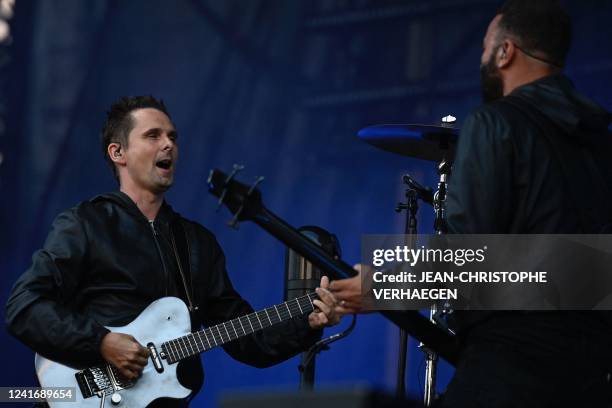 British singer and musician Matt Bellamy and British bassist and backing vocalist Christopher Tony Wolstenholme of rock band Muse perform during the...