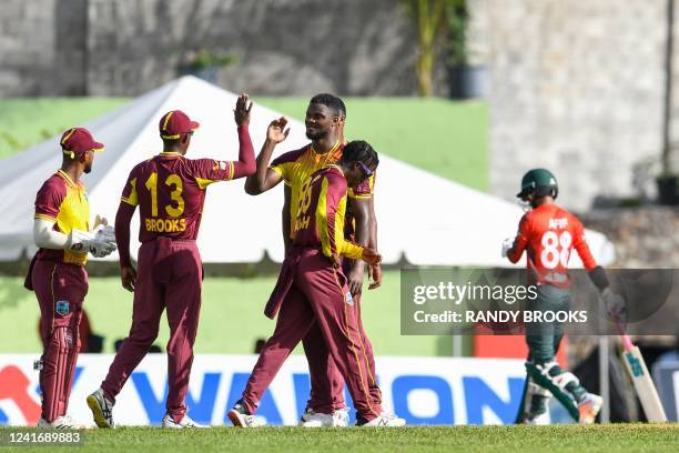 Romario Shepherd , of West Indies, celebrates the dismissal of Afif Hossain , of Bangladesh, during the second T20I between West Indies and...