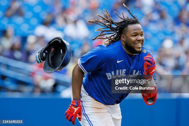 Vladimir Guerrero Jr. #27 of the Toronto Blue Jays runs out an RBI double in the ninth inning of their MLB game against the Tampa Bay Rays at Rogers...