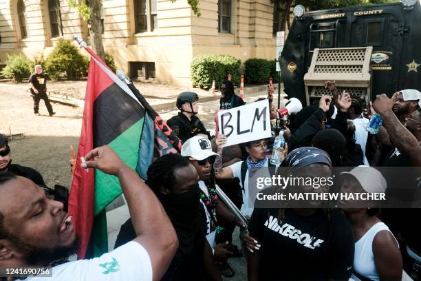 Sheriff officers snats in riot gear as demonstrators gather outside Akron City Hall to protest the killing of Jayland Walker, shot by police, in...