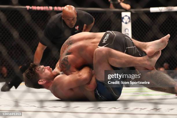 Jim Miller submits Donald Cerrone in their Welterweight bout during UFC 276 on July 02 at T-Mobile Arena in Las Vegas, Nevada.