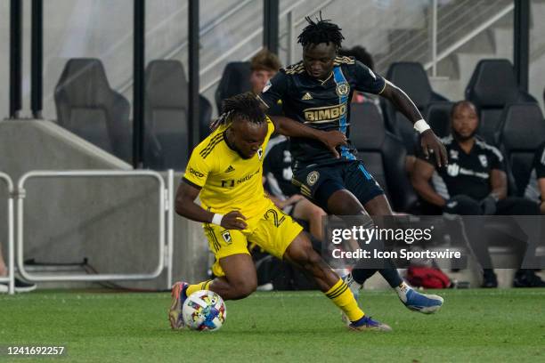 Columbus Crew midfielder James Igbekeme and Philadelphia Union defender Olivier Mbaizo battle for the ball during the game between the Columbus Crew...