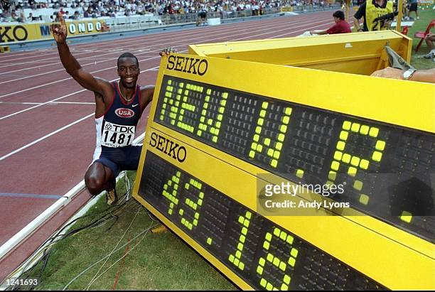 Michael Johnson of the USA celebrates his World Record race after winning the 400m in a time of 43.18 seconds at the 1999 World Championships held at...