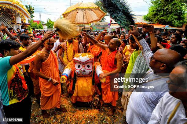 Hindu devotees seen carrying an Idol of Lord Jagannath during the Chariot Festival organized by the International Society for Krishna Consciousness ....