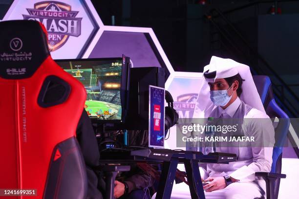 Esport athletes compete during Virtuocity Smash Open 2022 at the Doha Festival City in the Qatari capital on March 17, 2022.