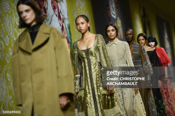 Models present a creation by Italian fashion designer and Christian Dior during the Women's Haute-Couture Fall - Winter 2023 Fashion Week in Paris on...