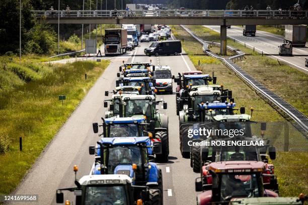 Farmers take part in a blockade of the A67 near Eindhoven to protest against government plans that may require them to use less fertilizer and reduce...