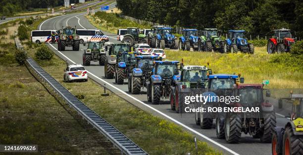 Farmers take part in a blockade of the A67 near Eindhoven to protest against government plans that may require them to use less fertilizer and reduce...