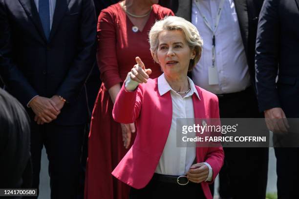 European Commission President Ursula von der Leyen gestures prior to a family picture at the start of a two-day International conference on...