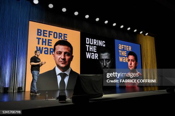 Ukrainian Minister for digitalisation, Mykhailo Fedorov delivers a speech next to pictures of Ukraine's President Volodymyr Zelensky during of a...