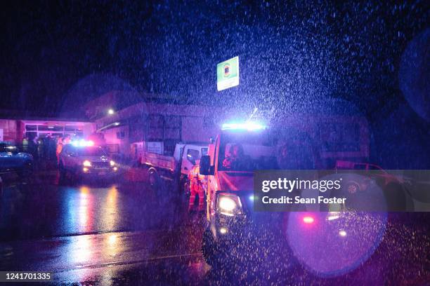 State Emergency Service and Rural Fire Brigade volunteers are seen during the evacuation of residents from the Woronora River area as floodwaters...