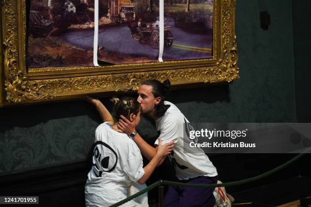 Just Stop Oil climate activists subvert The Hay Wain painting by John Constable and glue themselves to the frame at the National Gallery on the 4th...