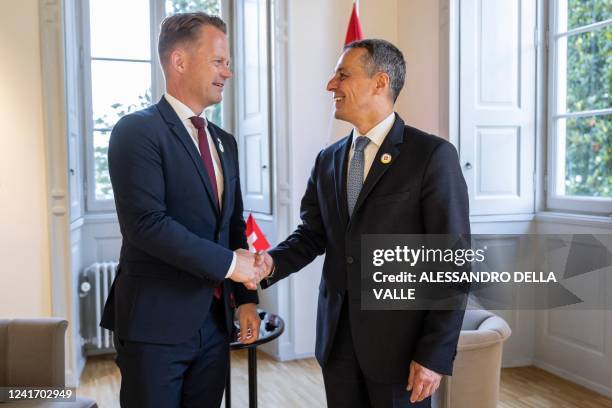 President of the Swiss Confederation Ignazio Cassis poses with Denmark's Minister of Foreign Affairs Jeppe Kofod as they meet for a bilateral meeting...