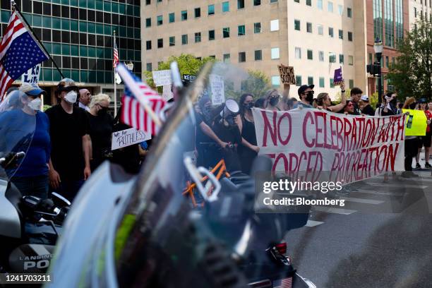 Abortion rights demonstrators block a Fourth of July parade during a national day of protest in Lansing, Michigan, US, on Monday, July 4, 2022. Since...