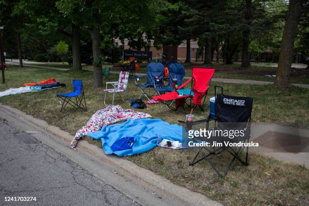 Chairs and blankets are left abandoned after a shooting at a Fourth of July parade on July 4, 2022 in Highland Park, Illinois. Reports indicate at...