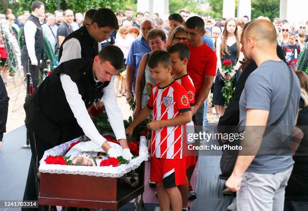 Relatives and friends attend a farewell ceremony for the late Ukrainian soccer coach Oleksandr Shyshkov who died during a rocket attack in Odesa...