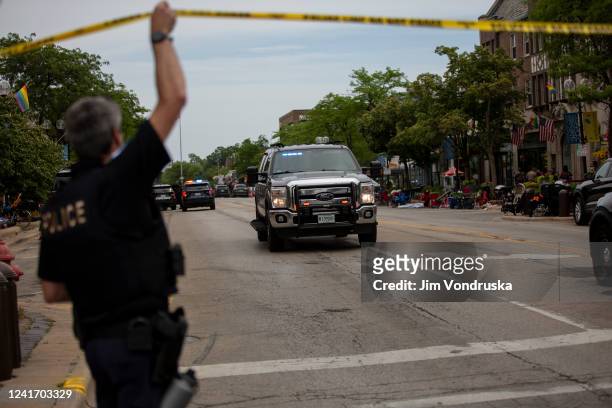First responders work the scene of a shooting at a Fourth of July parade on July 4, 2022 in Highland Park, Illinois. Reports indicate at least five...