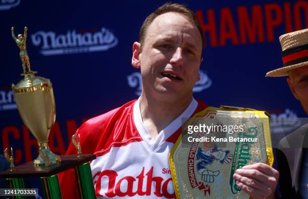 Joey Chestnut reacts after winning first place, eating 63 hot dogs in 10 minutes, during the 2022 Nathans Famous Fourth of July International Hot Dog...