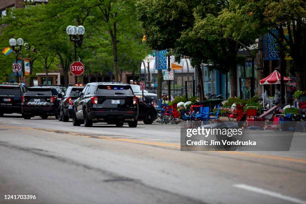 First responders work the scene of a shooting at a Fourth of July parade on July 4, 2022 in Highland Park, Illinois. Reports indicate at least five...