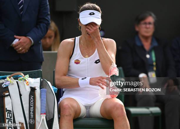 France's Alize Cornet applies ice in her thigh during her round of 16 women's singles tennis match against Australia's Ajla Tomljanovic on the eighth...